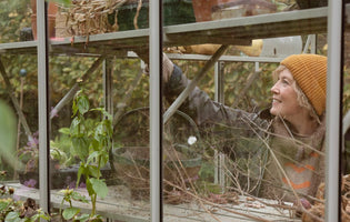 Kathy in her Rhino Greenhouse