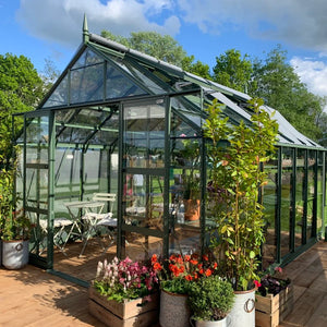 Greenhouse with table and chairs in the summer