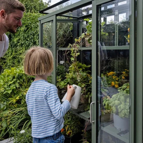 watering inside patio greenhouse